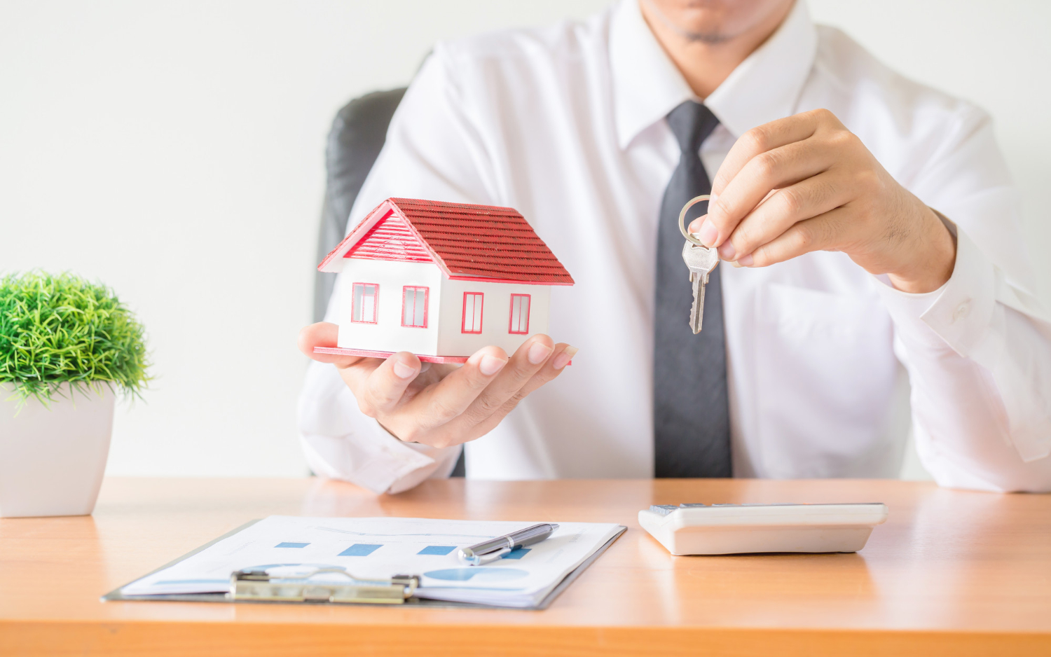 house-key-home-insurance-broker-agent-s-hand-protection